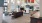 a clubroom with a tv, chairs, a couch and tables