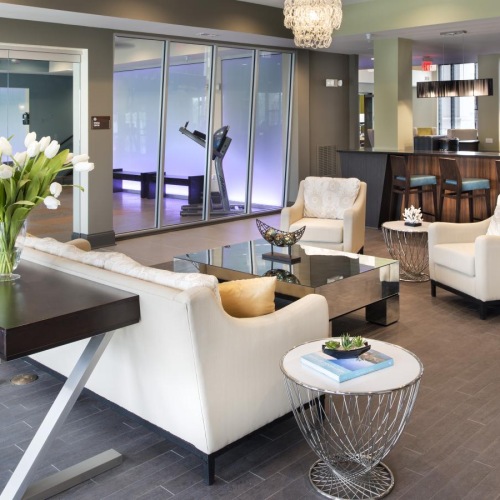 Access to resident-only features a clubroom with couches and tables