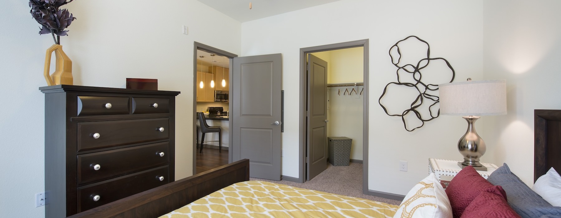 a bedroom with a bed and a fan