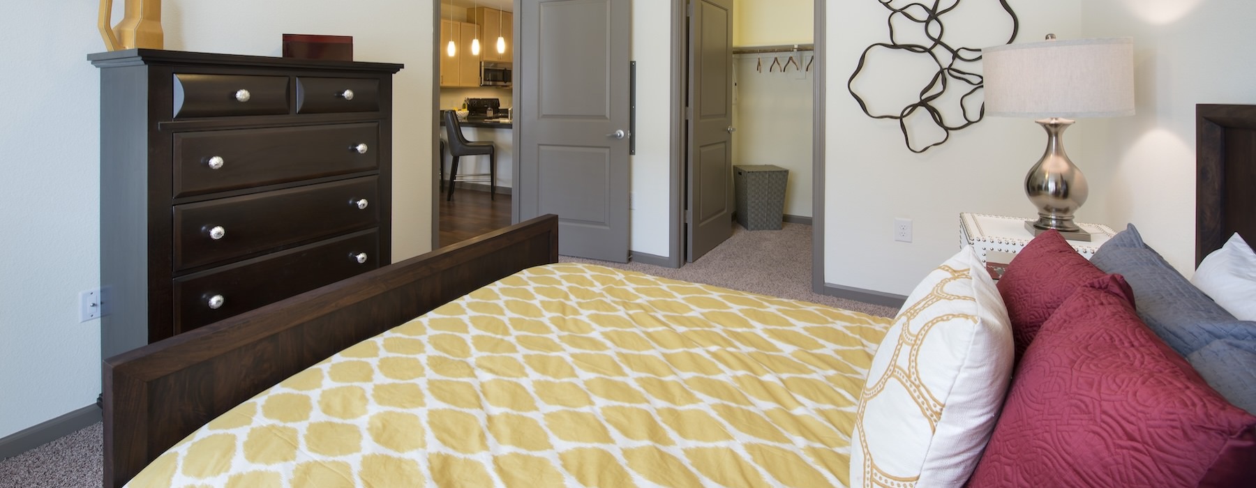 a bedroom with a bed and a fan
