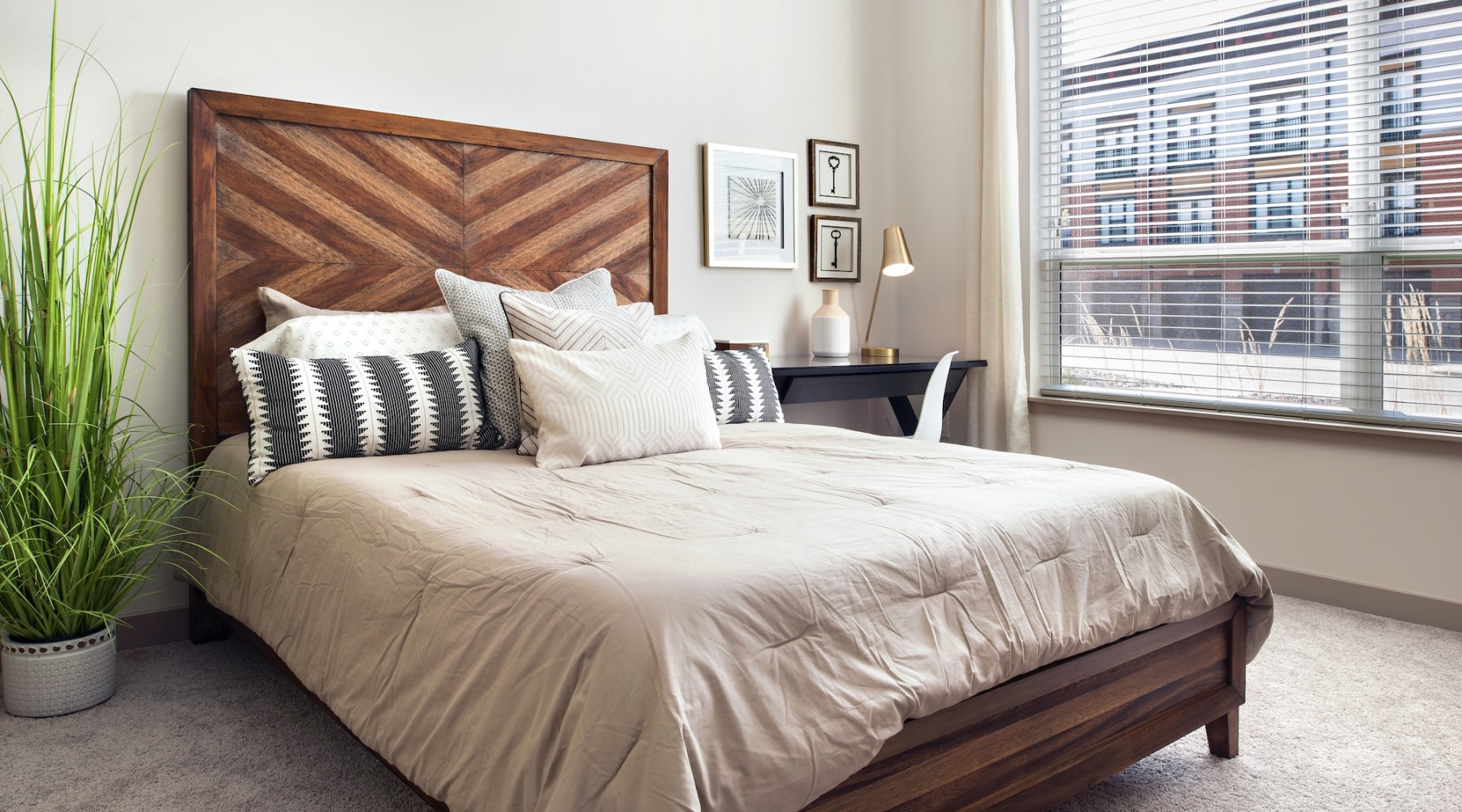Generous bedroom offerings to fit every family a bedroom with a bed and a side table