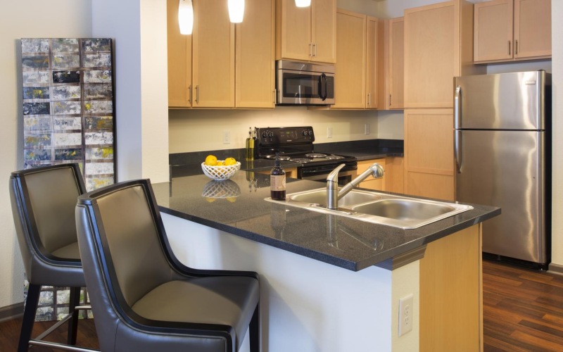a kitchen with a stainless steel sink