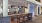 a large kitchen with a bar and chairs